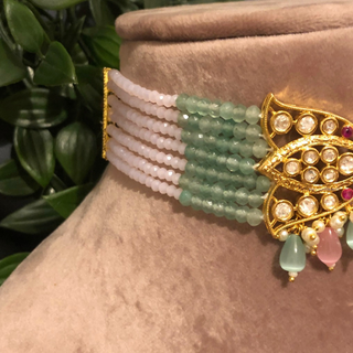Luxury baby pink and mint green beaded Kundan choker necklace set with matching earrings, elegant statement jewelry for South Asian bridal weddings and receptions.