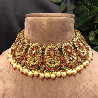 Luxury red and gold Kundan bridal necklace set with matching earrings and maang tikka, statement jewelry for South Asian weddings and nikah ceremonies.