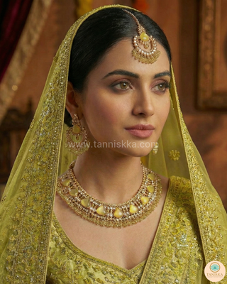 Luxury yellow Kundan bridal necklace set with matching earrings and maang tikka, elegant statement jewelry for South Asian weddings and nikah ceremonies.