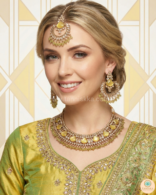 Luxury yellow Kundan bridal necklace set with matching earrings and maang tikka, elegant statement jewelry for South Asian weddings and nikah ceremonies.