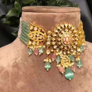 Luxury baby pink and mint green beaded Kundan choker necklace set with matching earrings, elegant statement jewelry for South Asian bridal weddings and receptions.
