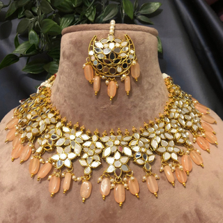 Luxury peach glass work Kundan bridal necklace set with matching earrings and headpiece, statement jewelry for South Asian weddings and nikah ceremonies.