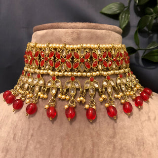 Luxury red and gold Kundan bridal necklace set with matching earrings and maang tikka, statement jewelry for South Asian weddings and nikah ceremonies.