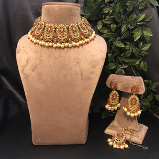 Luxury red and gold Kundan bridal necklace set with matching earrings and maang tikka, statement jewelry for South Asian weddings and nikah ceremonies.
