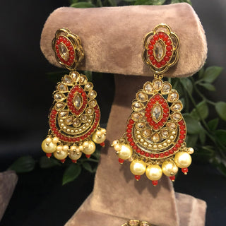 Luxury red and gold Kundan bridal necklace set with matching earrings and maang tikka, statement jewelry for South Asian weddings and nikah ceremonies.