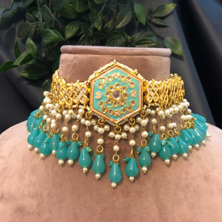 Luxury turquoise meenakari Kundan choker necklace set with matching earrings and maang tikka, vibrant statement jewelry for South Asian bridal weddings and festive occasions