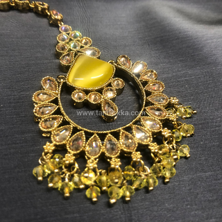 Luxury yellow Kundan bridal necklace set with matching earrings and maang tikka, elegant statement jewelry for South Asian weddings and nikah ceremonies.